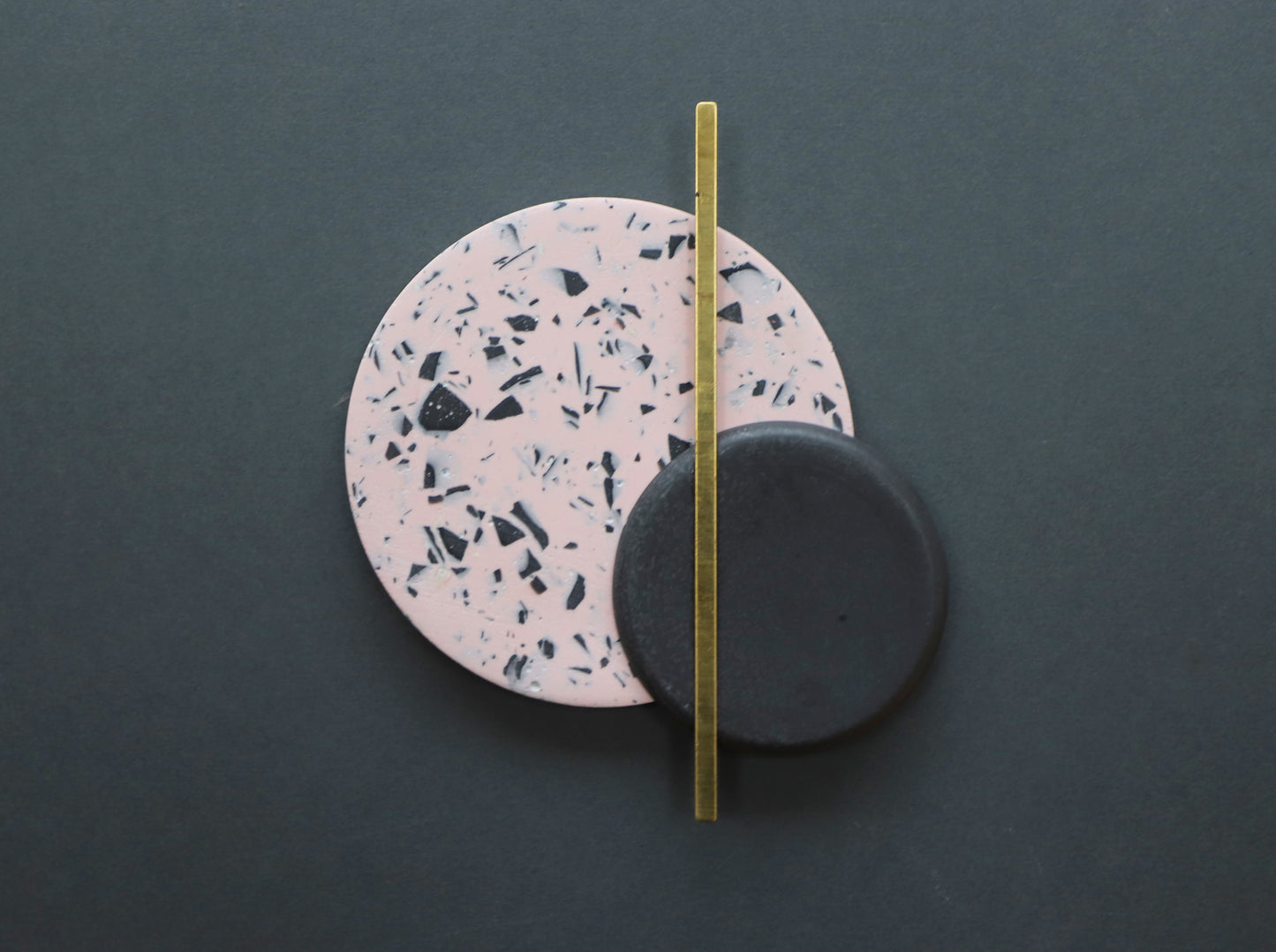 Black stoneware and terrazzo pink, black & brass wall hanging