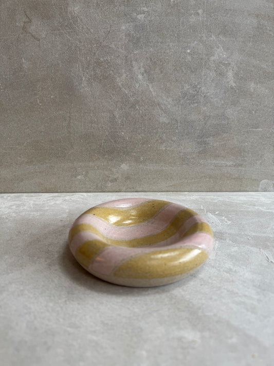 Hollow rimmed dish with pink and mustard stripes