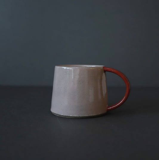 Stoneware cup in blush pink and dark red colour block